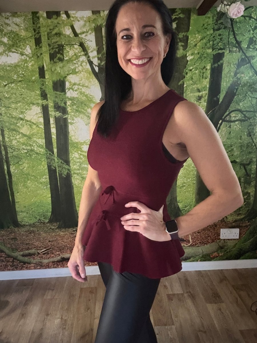 Peplum sleeveless knit top