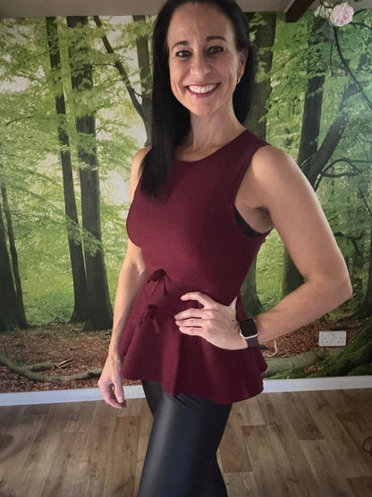 Peplum sleeveless knit top