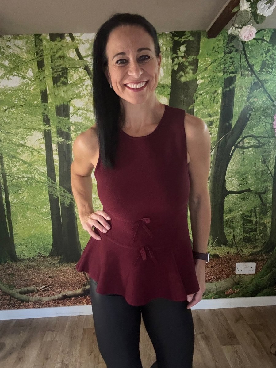 Peplum sleeveless knit top