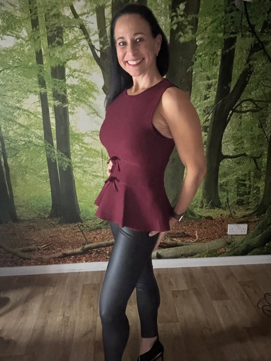 Peplum sleeveless knit top