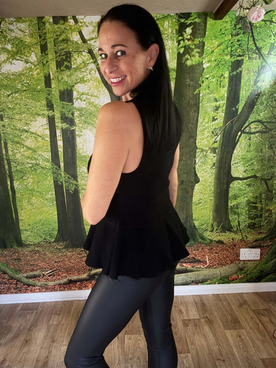 Peplum sleeveless knit top