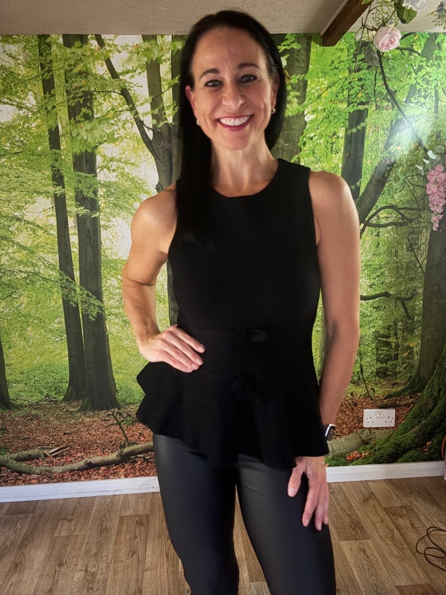 Peplum sleeveless knit top