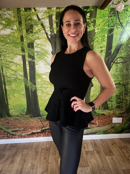 Peplum sleeveless knit top