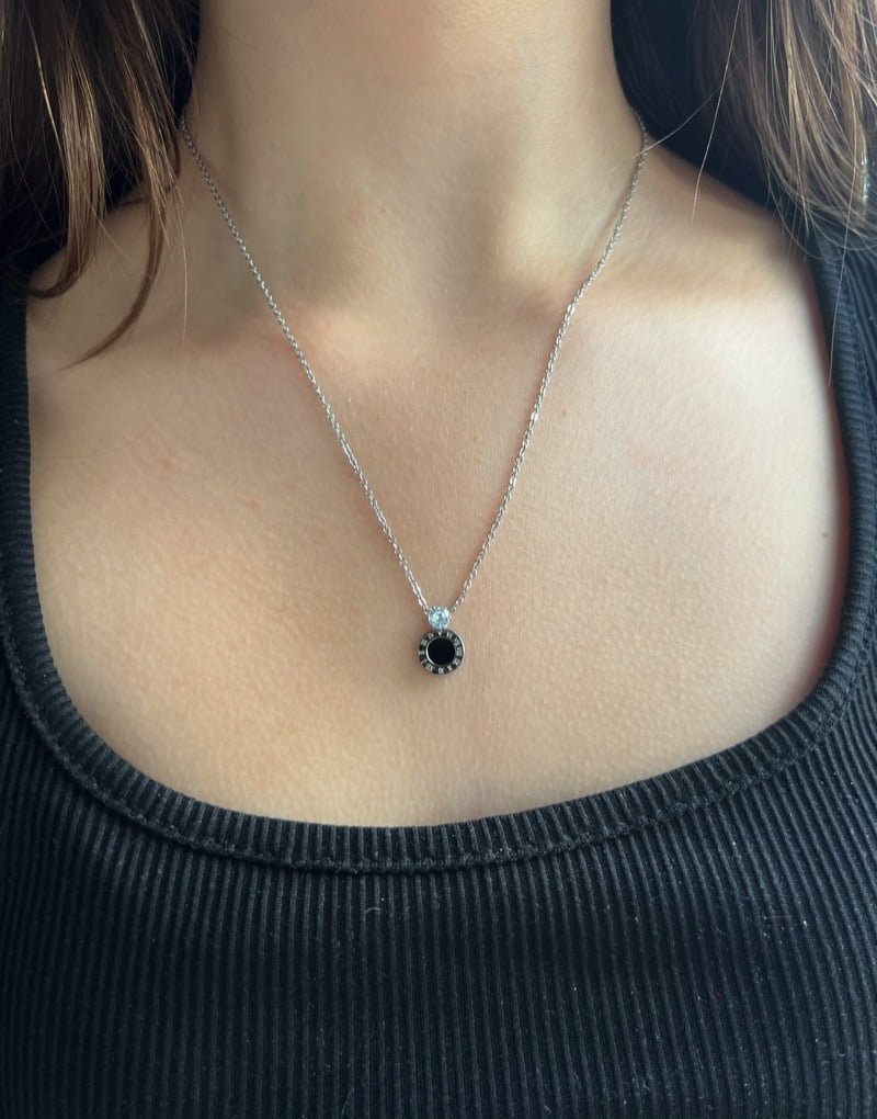 Roman numeral with diamanté necklace