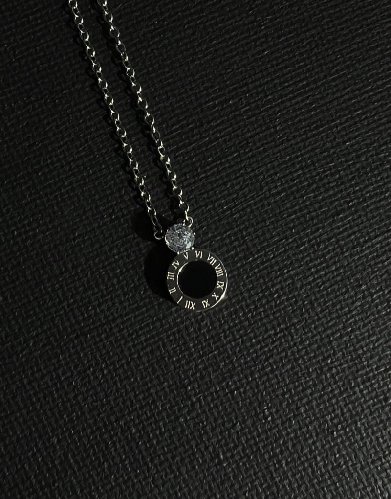 Roman numeral with diamanté necklace